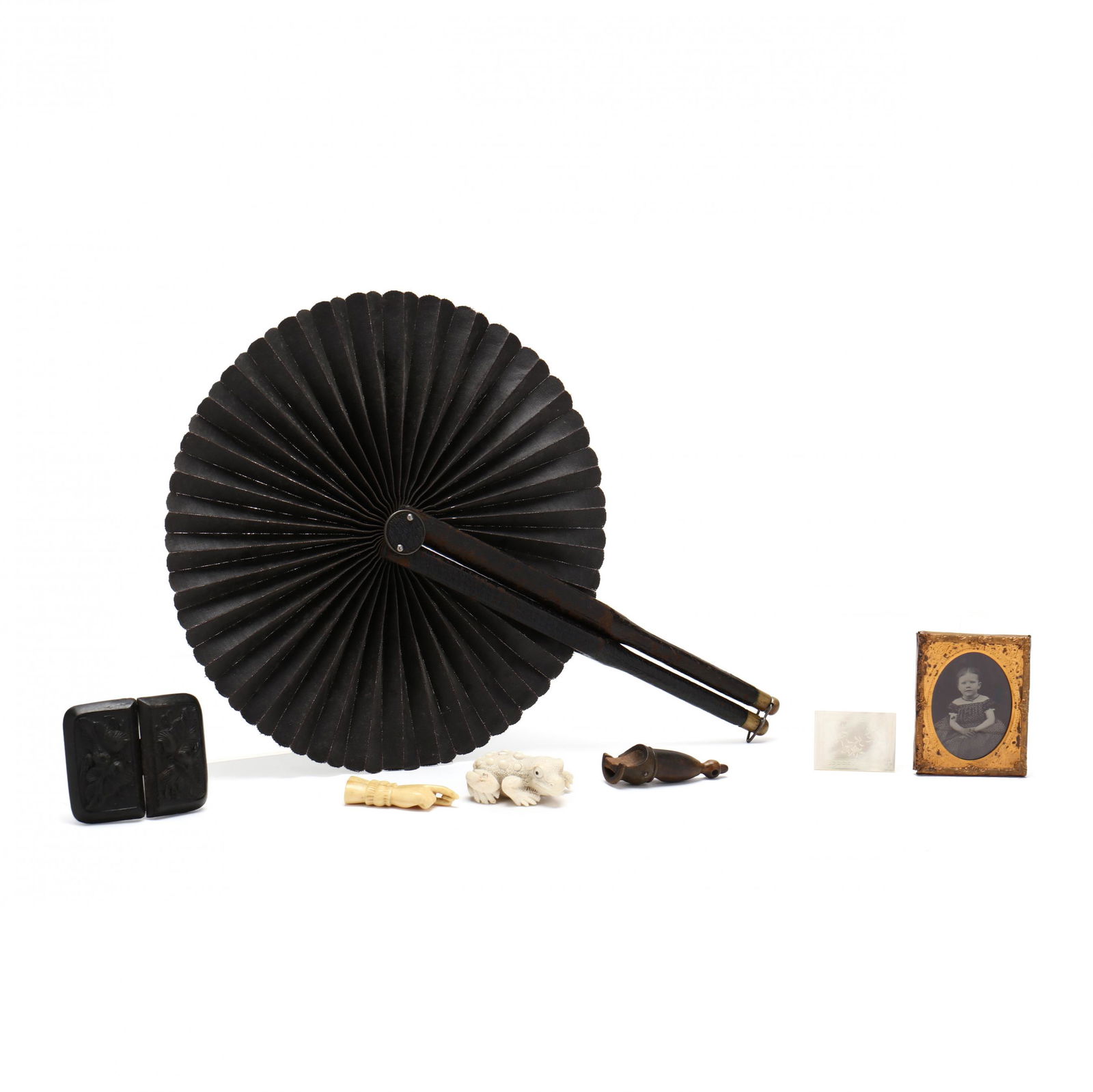 A Grouping of Seven Victorian Decorative Table Accessories: A Grouping of Seven Victorian Decorative Table Accessoriesthe first a ruby ambrotype, circa 1860, depicting a seated child in dress with surrounding brass frame with oval window (2 1/2 x 2 in.); a car