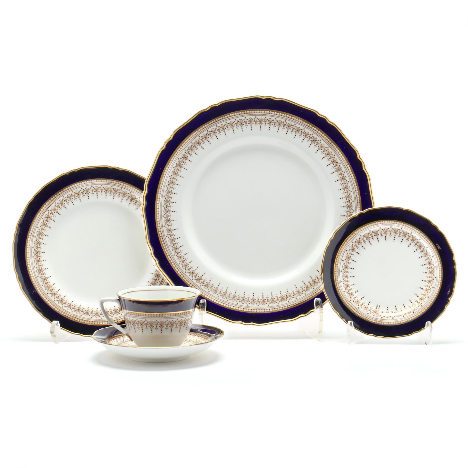 Royal Worcester, (57) Pieces of Regency Blue Bone China Dinnerware: Royal Worcester, (57) Pieces of Regency Blue Bone China DinnerwareEngland, including (12) dinner plates (10 3/4 in.); (12) salad plates (8 in.); (11) cups (2 1/2 in.); (9) saucers with curved bowl (1