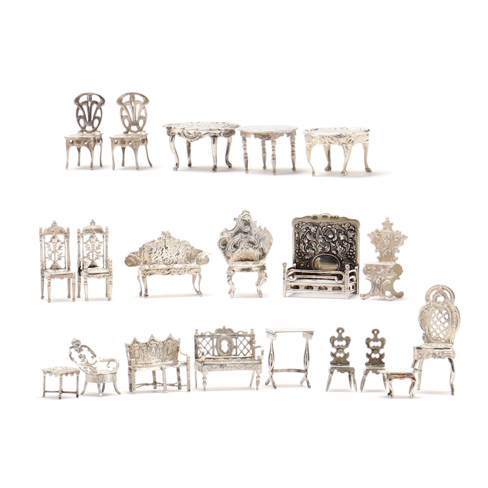 Twenty Silver Miniature Models of Dollhouse Furniture: Twenty Silver Miniature Models of Dollhouse Furnitureincluding (6) chairs, (3) tables, and (2) settees marked for .800 silver or higher; and (4) chairs, (2) settees, and (3) tables that are unmarked.