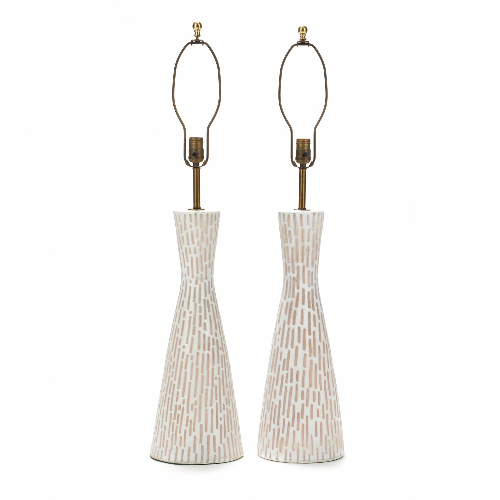 Raymor, Pair of Tall Pottery Table Lamps: Raymor, Pair of Tall Pottery Table Lamps1950s, Italy, tall hourglass shaped white glazed pottery with geometric block pattern, signed. HOA 38 in. Additional high-resolution photos are available at ww