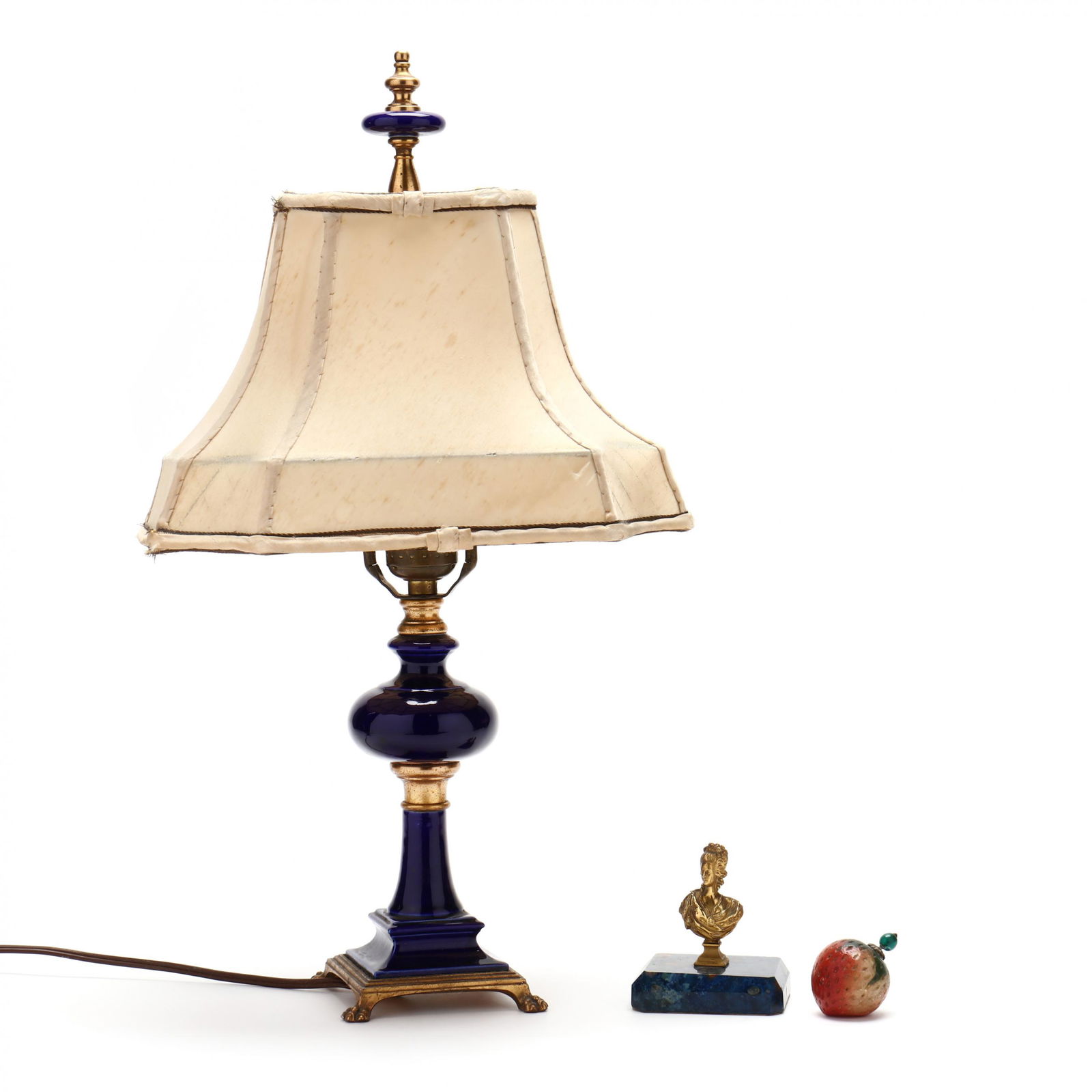 A Grouping of Three Boudoir Table Accessories: A Grouping of Three Boudoir Table Accessoriesincluding a cobalt glazed porcelain table lamp with ormolu mounts and square paw foot base, includes silk shade (18 1/4 in.) (shade with tears and staining