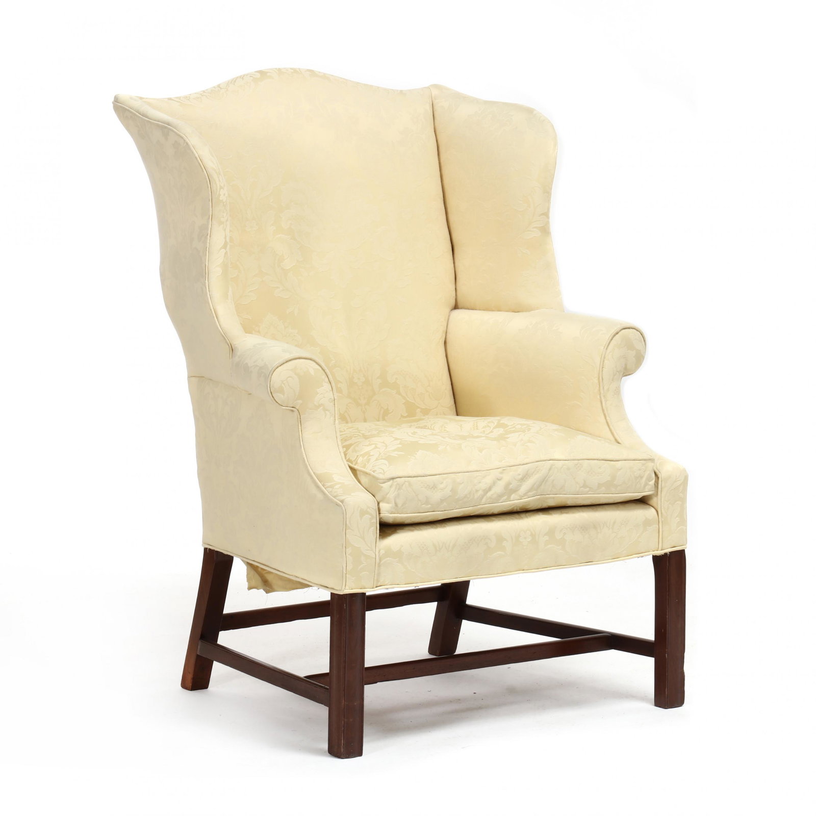 American Chippendale Mahogany Easy Chair: American Chippendale Mahogany Easy Chair attributed to Philadelphia, circa 1780, birch secondary, scalloped crest rail with shaped wings, scrolled arms, slip seat, light yellow damask upholstery, mold