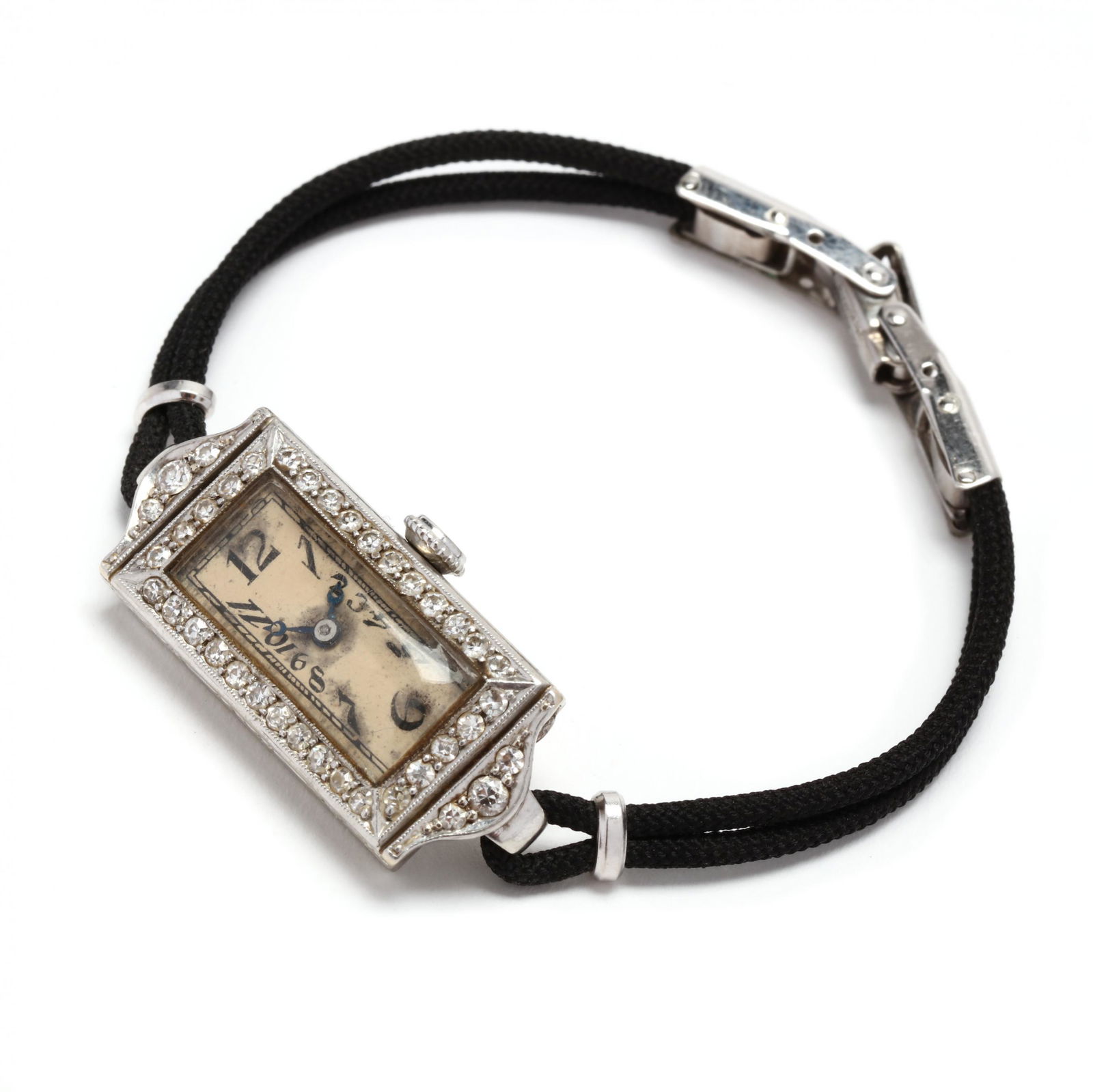 Antique White Gold and Diamond Watch, Cresarrow Watch Co.: Antique White Gold and Diamond Watch, Cresarrow Watch Co.manual wind with seventeen jewels, the rectangular case set with old European and single cut round diamonds weighing approximately .55 total ca