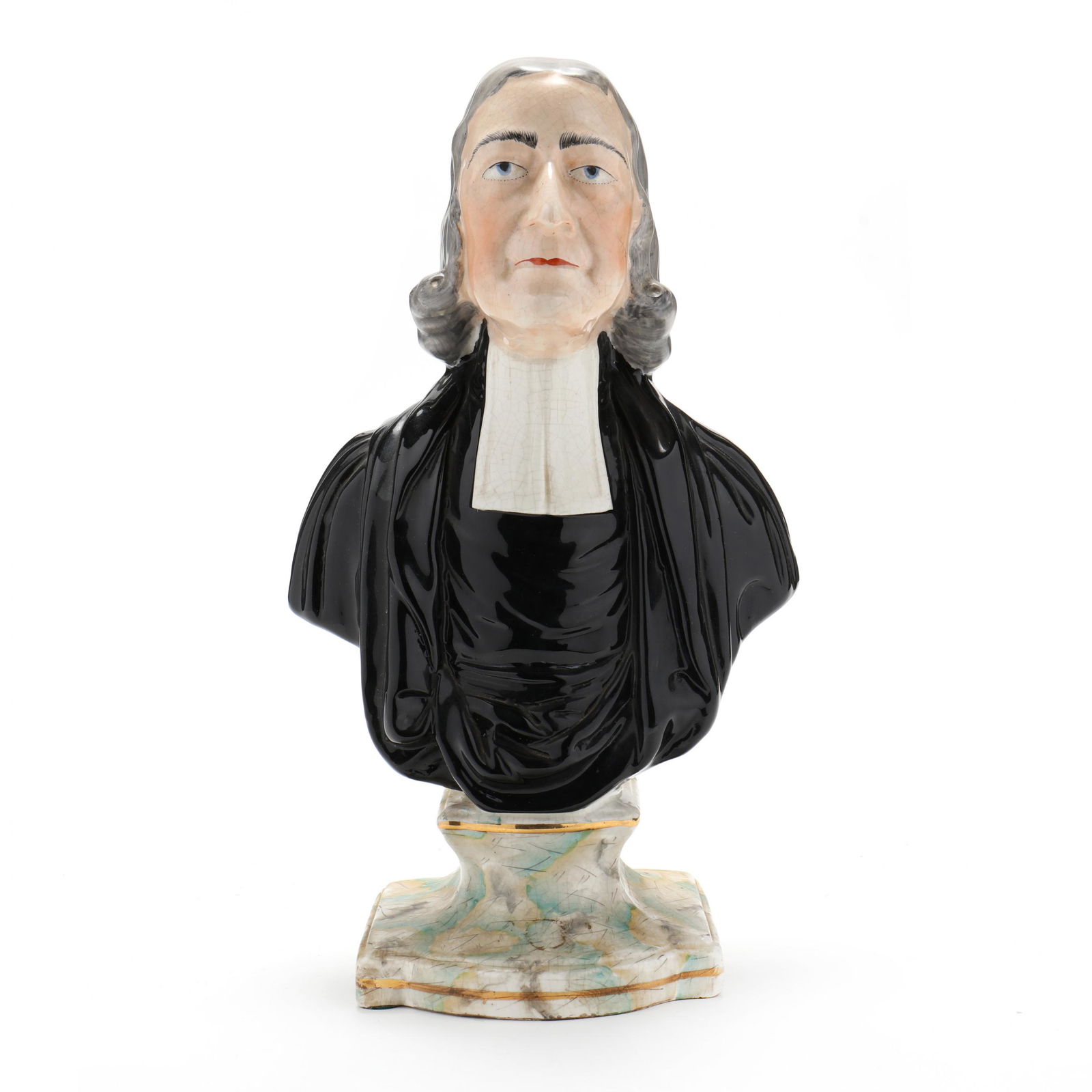 Staffordshire Bust of the Reverend John Wesley: Staffordshire Bust of the Reverend John Wesleycirca 1860, hand-painted and gilt pearlware, modeled after the original sculpture by Enoch Wood in 1781, the shaped plinth with marble finish and gilt lin