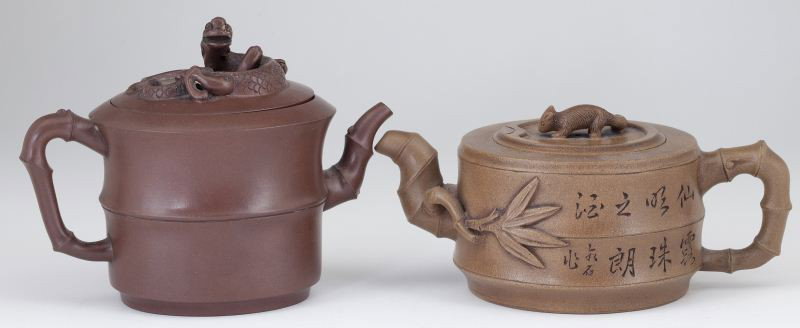 Two Figural Chinese Yixing Teapots: Two Figural Chinese Yixing Teapots maker's marks on the undersides, both with bamboo form spouts and handles, the first pot (3.5 in.) is dark tan and has a squirrel finial as well as a secondary mark 