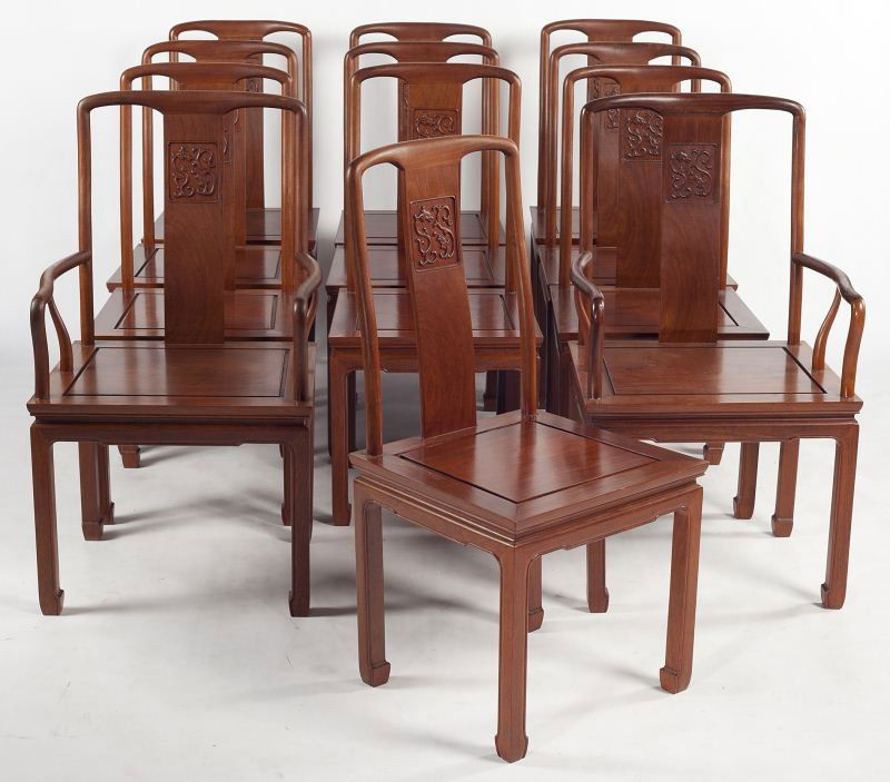 Set of Twelve Chinese Art Deco Dining Chairs: Set of Twelve Chinese Art Deco Dining Chairs early 20th century, including (10) side chairs and (2) armchairs, mahogany, shaped central splat with relief carved double dragons, panel seat, molded skir