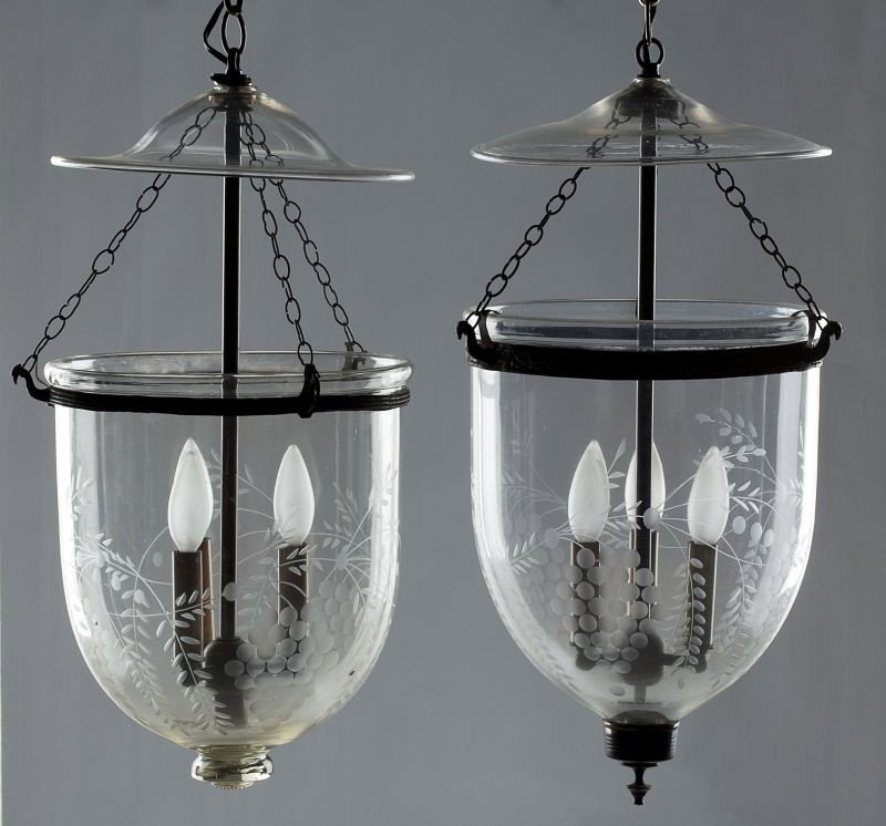 Two Hanging Bell Candle Lamps: Two Hanging Bell Candle Lamps with smoke caps, early 20th century, each lamp with three candle lights, of etched clear blown glass, brass mounts. 22 x 11 in. Private Collection from a 40 year collecto