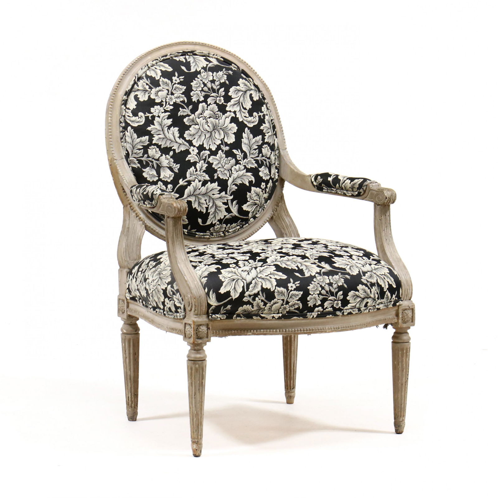 Vintage Louis XVI Style Carved and Painted Fauteuil: Vintage Louis XVI Style Carved and Painted Fauteuilearly 20th century, carved and painted wood frame with a beaded edge, woven black and white floral upholstery, fluted tapered legs. 39.5 x 26.25 x 23