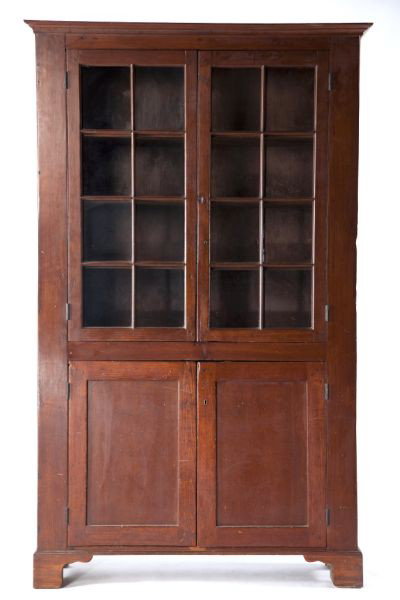 North Carolina Flatwall China Cabinet: North Carolina Flatwall China Cabinet Piedmont area, circa 1830s, yellow pine and poplar, having an applied stepped cornice over two doors, each with eight lights above two raised paneled doors. 87 x 