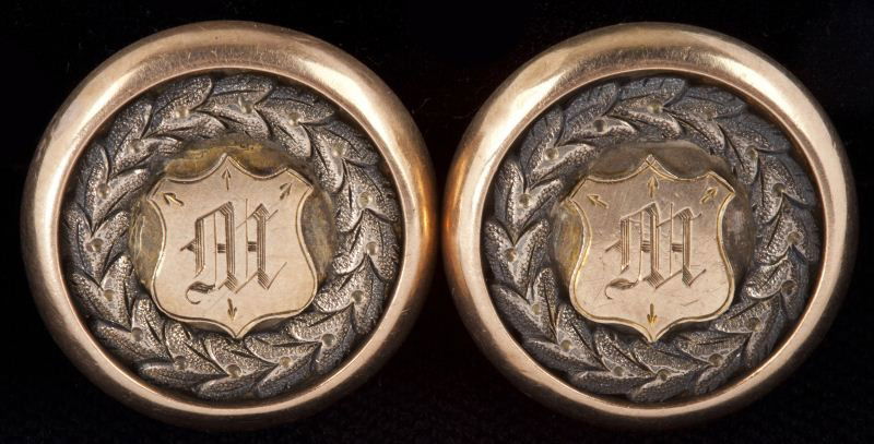 14KT Antique Rose Gold Cufflinks: 14KT Antique Rose Gold Cufflinks of circular form with shield shape inset bearing monogram "M" with laurel leaf surround, unmarked but tests for 14KT. .75 in. From Cassina Point Plantation, Edisto Isl