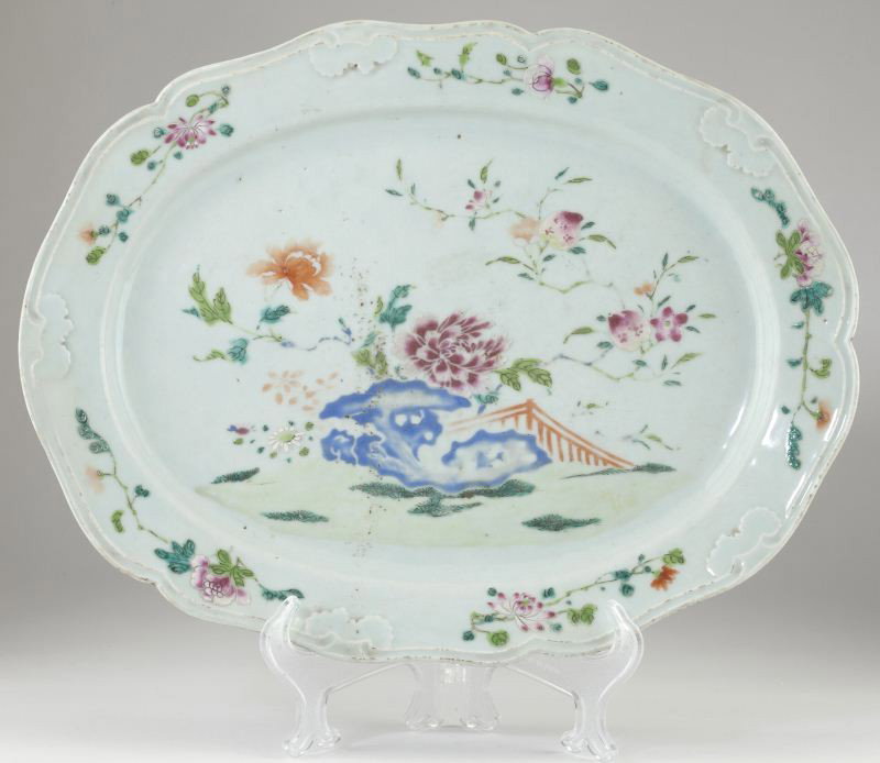 Chinese Export Porcelain Platter: Chinese Export Porcelain Platter 19th century, in the Famille Rose palette with a celadon glaze, oval form with molded rim featuring stylized bats, the center with landscape, peaches, and flowers. 16.