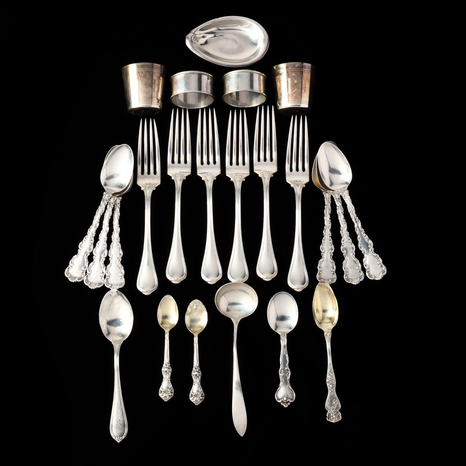 A Grouping of Sterling Silver Flatware and Table Accessories: A Grouping of Sterling Silver Flatware and Table Accessories(26) pieces, including: (4) Reed & Barton Silver Sculpture Nut Dishes (3 3/8 in.) (some denting to rims); (2) Reed & Barton napkin rings (1