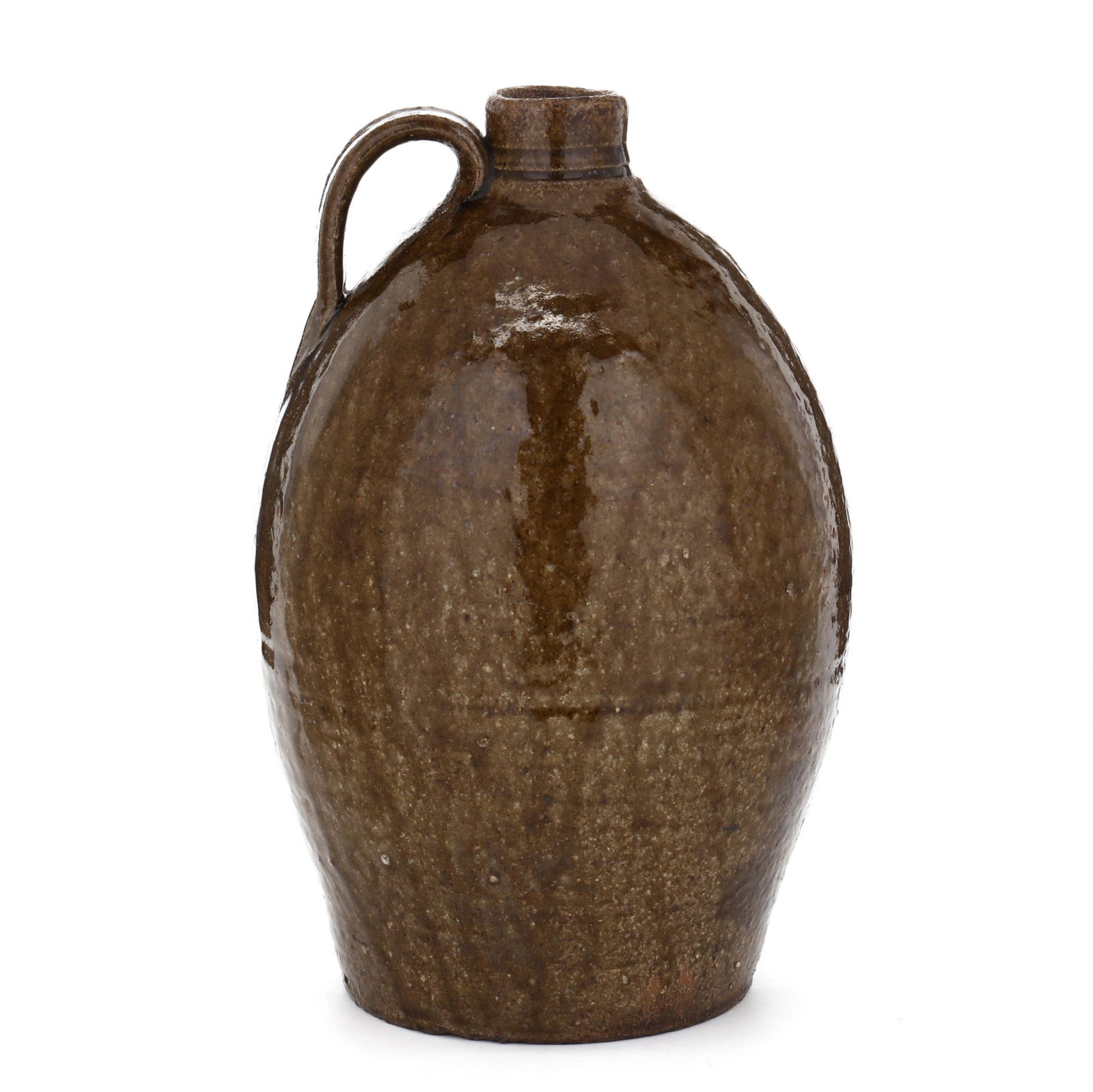 John Goodman (1822-1907 Lincoln County, NC), One Gallon Jug: John Goodman (1822-1907 Lincoln County, NC), One Gallon Jugalkaline glazed with subtle streaks, gentle ovoid form with straight mouth over incised rings, applied strap handle, stamp "JG 1". 11 x 6 in.