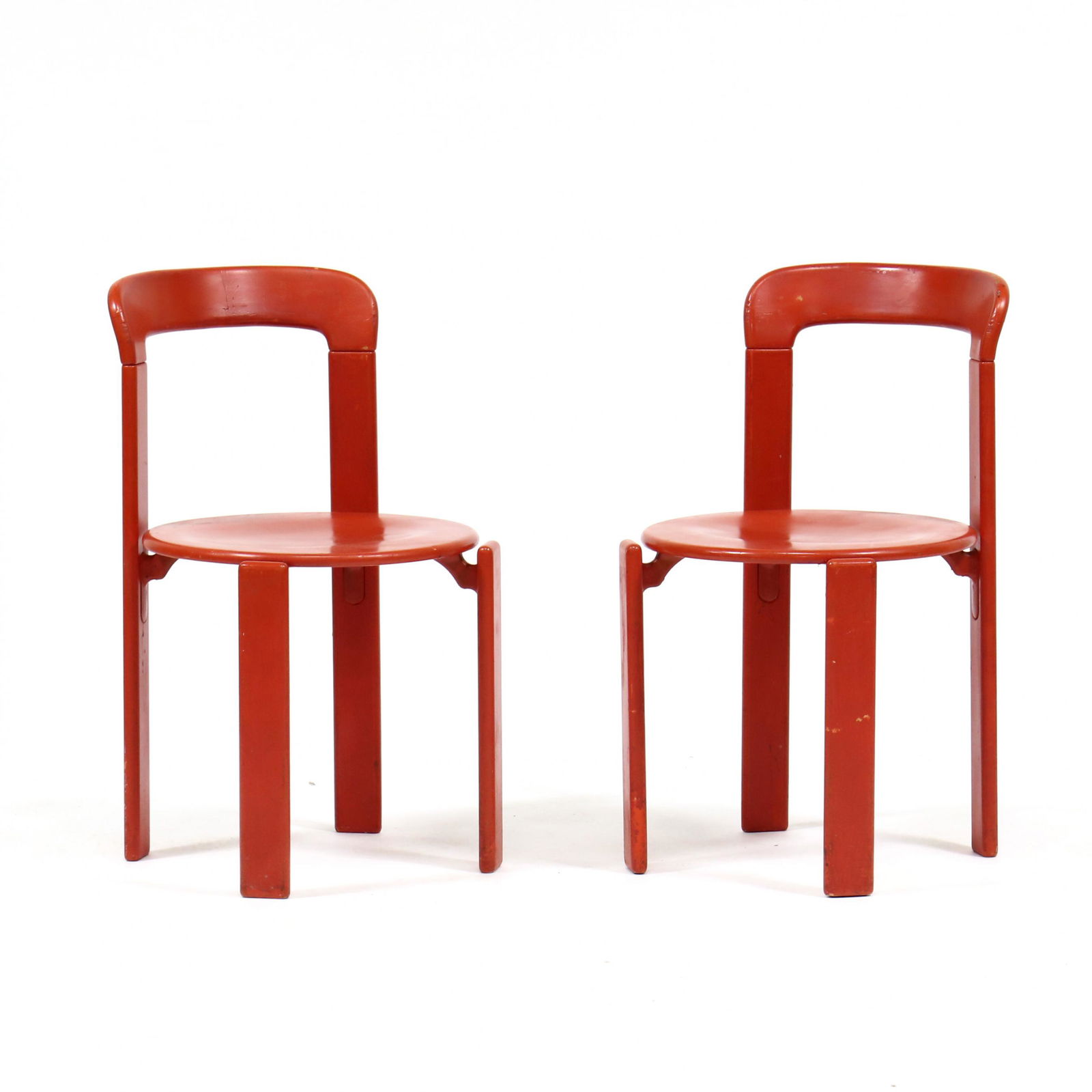 Bruno Rey, (Swiss, 1935-2019), Pair of Red Lacquered Stacking Chairs: Bruno Rey, (Swiss, 1935-2019), Pair of Red Lacquered Stacking ChairsStendig, red lacquered wood with metal supports, labeled. 30 x 17.5 x 17.5 in. Private Collection of Modern Art and Design, North Ca