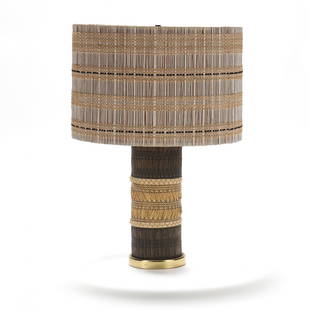 Straw Grass Lamp with Maria Kipp Shade: Straw Grass Lamp with Maria Kipp Shade 1950s, Maria Kipp woven chenile and wood drum shade over a woven grass lamp base, single light fixture having brass cap and base, unmarked. 28 x 20 x 20 in. Add