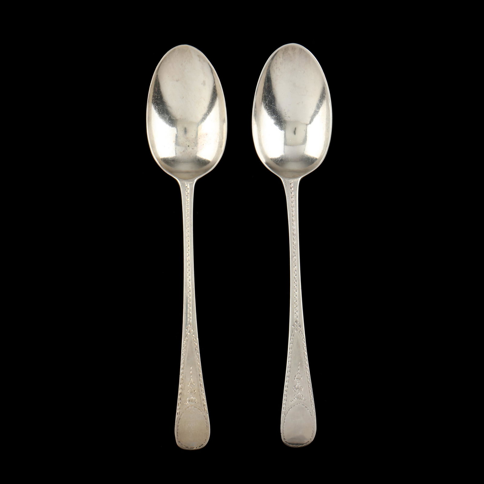 A Pair of George III Silver Tablespoons: A Pair of George III Silver Tablespoonsmark of George Gray, London, 1794 date marks, both with later bright cut bellflower and engraved designs, vacant cartouche. 8 3/8 in. 2.70 troy oz. From the Coll