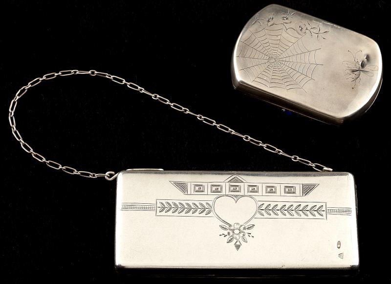 Two Russian Silver Purses: Two Russian Silver Purses the first of rectangular form with parcel gilt, the hinged cover engraved with a spider web and insect, the clasp with inset blue glass, Cyrillic maker's mark possibly that o