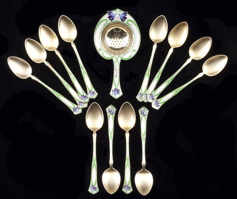 Set of Enameled Sterling Tea Spoons & Strainer: Set of Enameled Sterling Tea Spoons & Strainerby David Andersen (Norway, active 1924-1939), each with floral Art Nouveau enamel decoration to handle and gilt bowl, the set includes (12) spoons (4.25 i