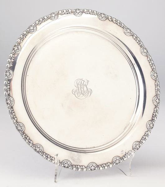 Tiffany & Co. Footed Sterling Tray: Tiffany & Co. Footed Sterling Tray circular form with egg and dart and tassel border, the center engraved with entwined letter cipher, made under the directorship of John C. Moore II. 1 1/8 x 12 in. 2