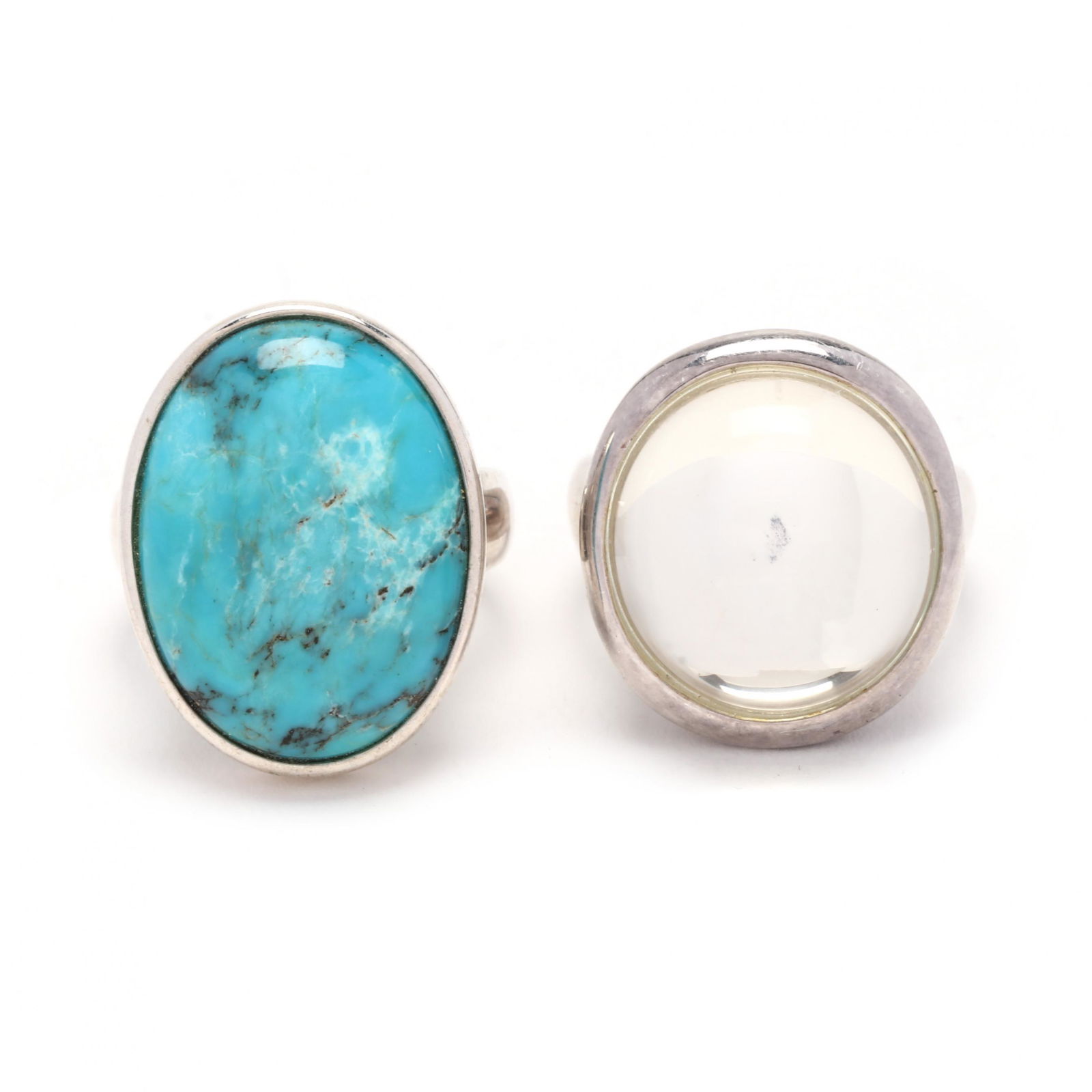 Two Sterling Silver and Gem-Set Rings: Two Sterling Silver and Gem-Set Ringsto include: a ring with a round cabochon rock crystal quartz (18.66 x 17.17 mm), stamped 925 China and signed RLM Studio for Robert Lee Morris (ring size 9); and a
