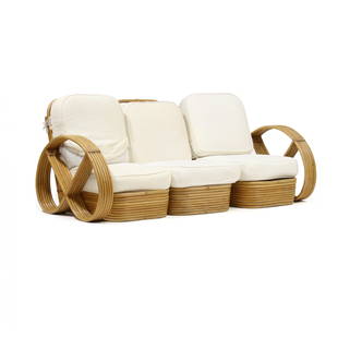 After Paul Frankl, Rattan Pretzel Sofa: After Paul Frankl, Rattan Pretzel Sofa1940s, Tochiku Industry Co., Japan, three-part form, with cushions, labeled. Purchased in Tokyo after WWII by a state department employee who brought it back to t