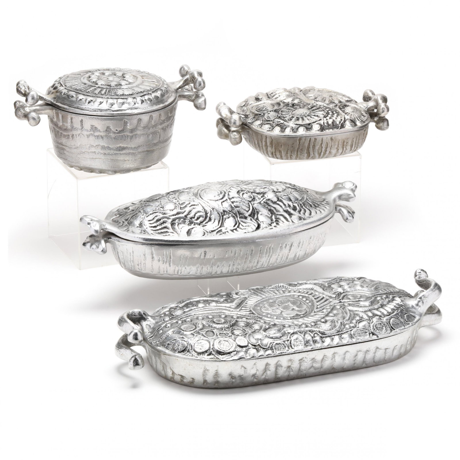 Don Drumm (OH/NC, b. 1935), Four Vintage Pieces of Modernist Cookware: Don Drumm (OH/NC, b. 1935), Four Vintage Pieces of Modernist Cookwarecirca 1969, each of a silver tone Drumm Alloy, including a 4 quart oval lidded dish (5 x 19 x 8 in.); a 3.5 quart lidded dish (4 x