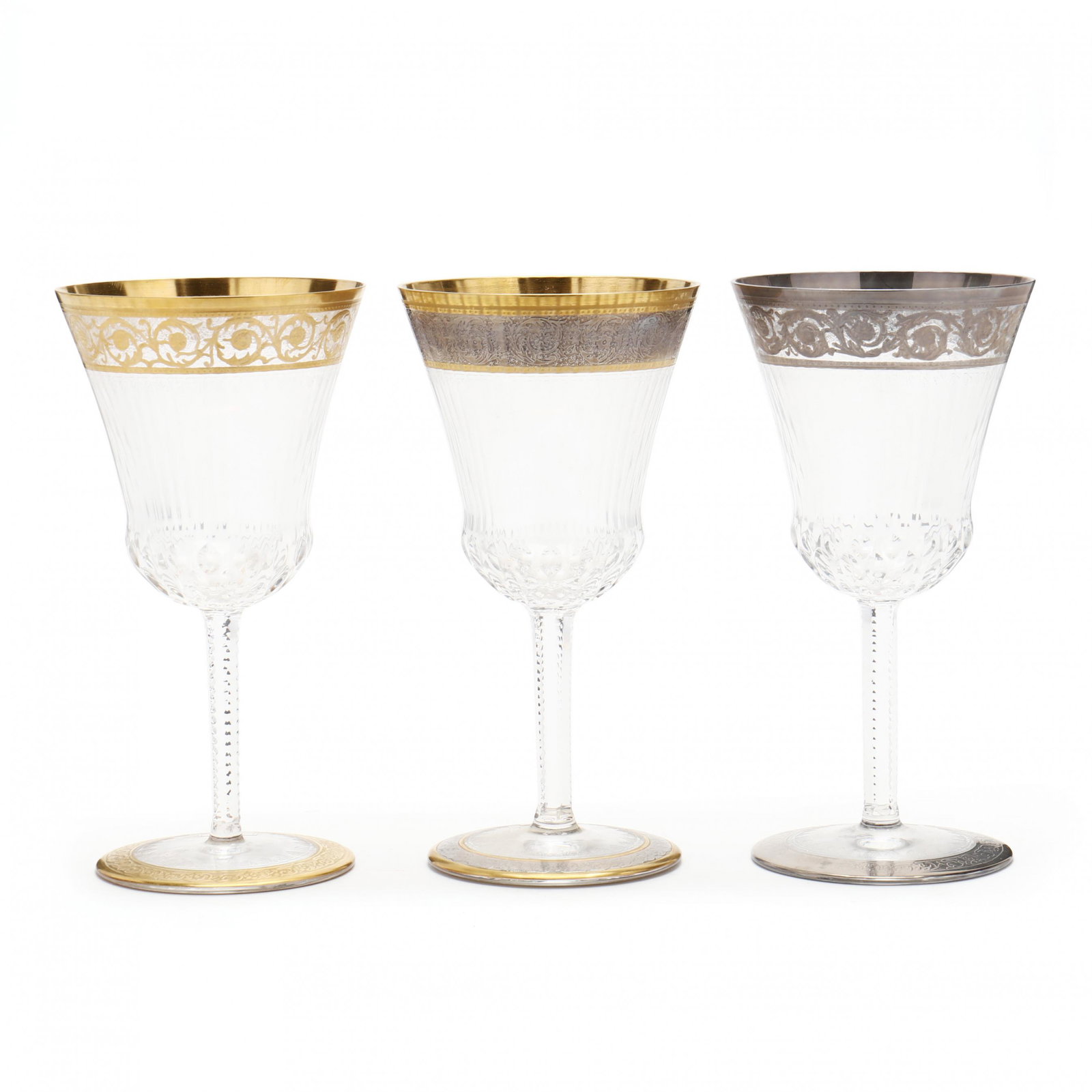 Three St. Louis Crystal Platinum and Gold Rimmed Wine Goblets: Three St. Louis Crystal Platinum and Gold Rimmed Wine Goblets France, late 20th century, all in the thistle pattern with various rim finishes, signed. 7 in. Additional high-resolution photos are avail