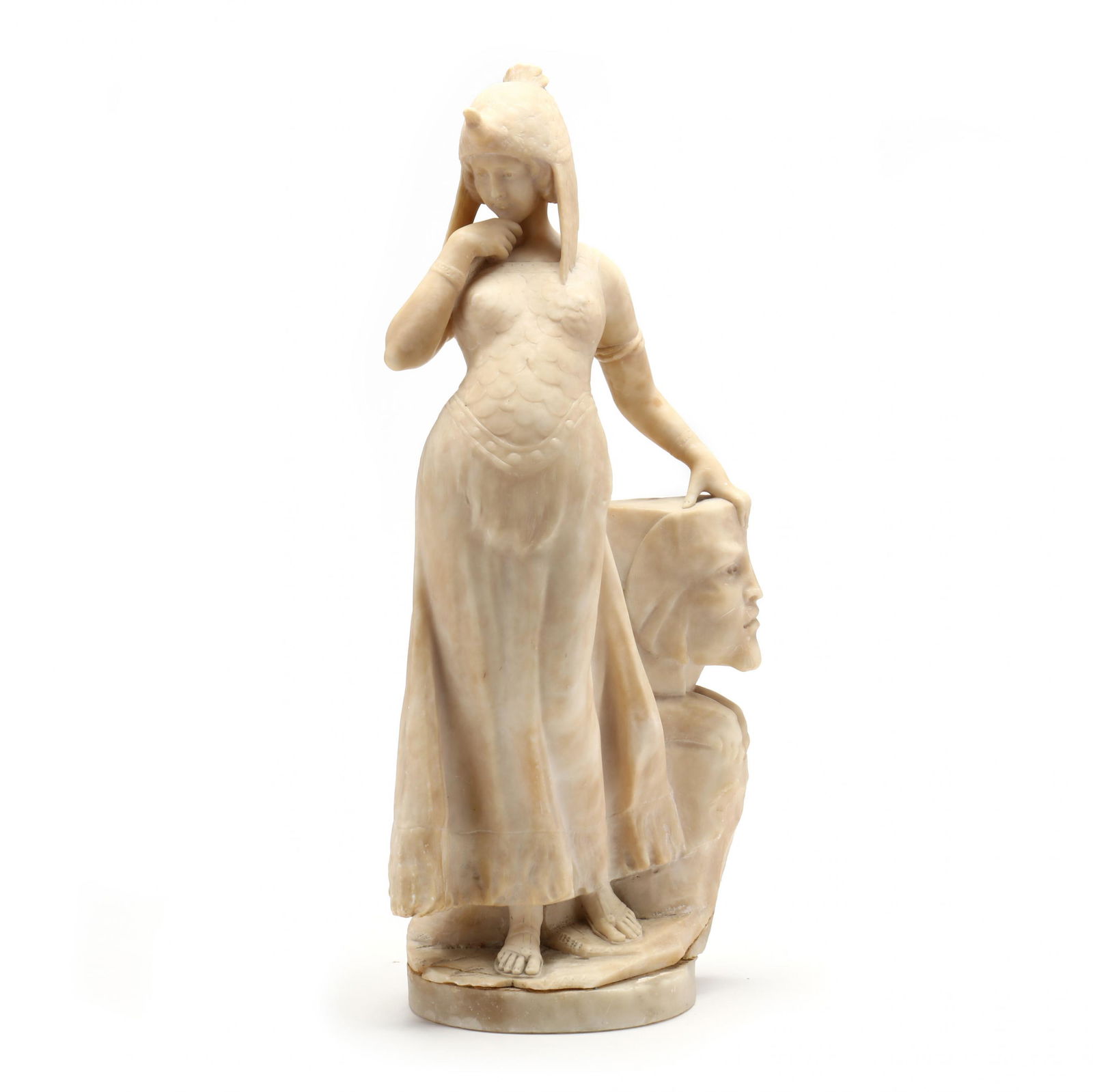 A Romanticized Carved Alabaster Sculpture of an Egyptian Queen: A Romanticized Carved Alabaster Sculpture of an Egyptian Queenlate 19th century, unsigned, likely Italian, the queen is depicted standing and dressed in cuirass over a long skirt and wearing a vulture