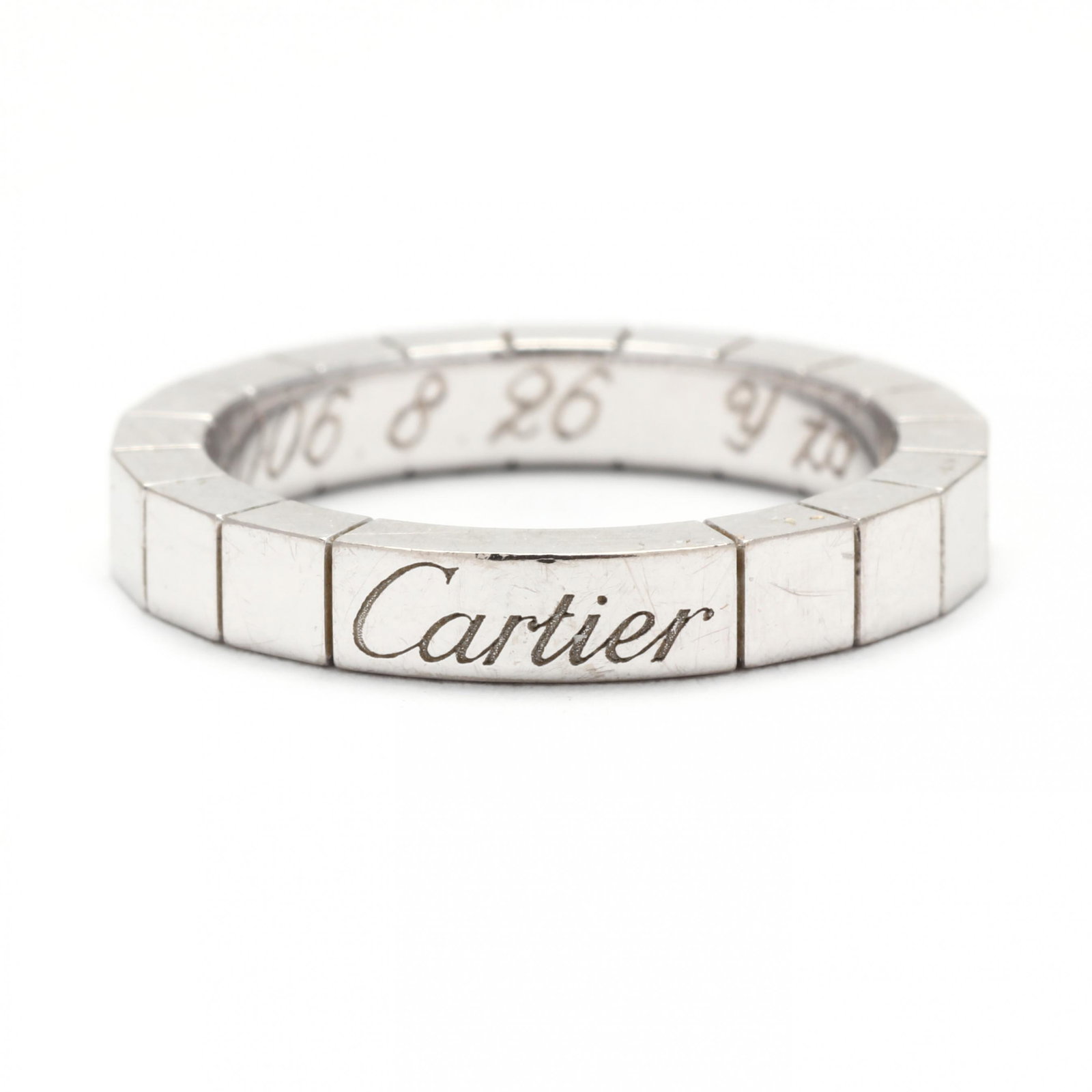 White Gold Lanières Band, Cartier: White Gold LaniÃ¨res Band, Cartier segmented white gold band with Cartier signature to front, gift inscription to interior, stamped 750, with Italian registry mark 1 TO, numbered EM 2226, and stampe