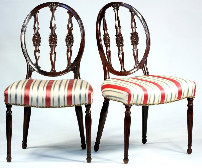 Two Sheraton Style Side Chairs: Two Sheraton Style Side Chairs circa 1900; mahogany, oval back with triple foliate supports, four turned legs, the front legs with fluting, striped silk upholstery, nail head trim. 37.5 x 22 x 19 in.