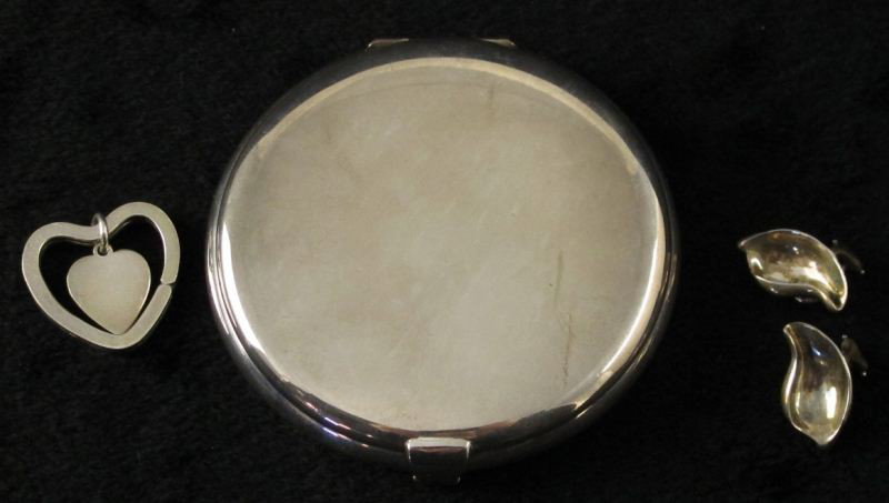 (3) Tiffany Sterling Fashion Items, (1) Peretti: (3) Tiffany Sterling Fashion Items, (1) Peretti the first, a bean form clip on earring signed Tiffany / Peretti (7/8 in.); the second a heart shaped key ring (1.5 in.); the second a powder compact wit