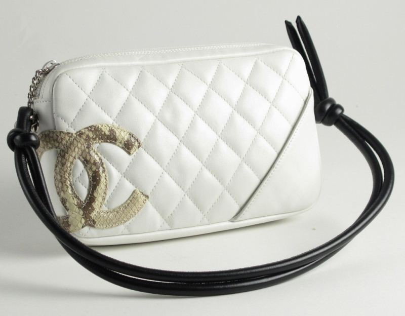 Leather and Python "Cambon" Bag, Chanel: Leather and Python "Cambon" Bag, Chaneldesigned as a quilted white pouchette with python intertwined Chanel Logo, completed by black leather handles and palladium hardware, authenticity tag located wi