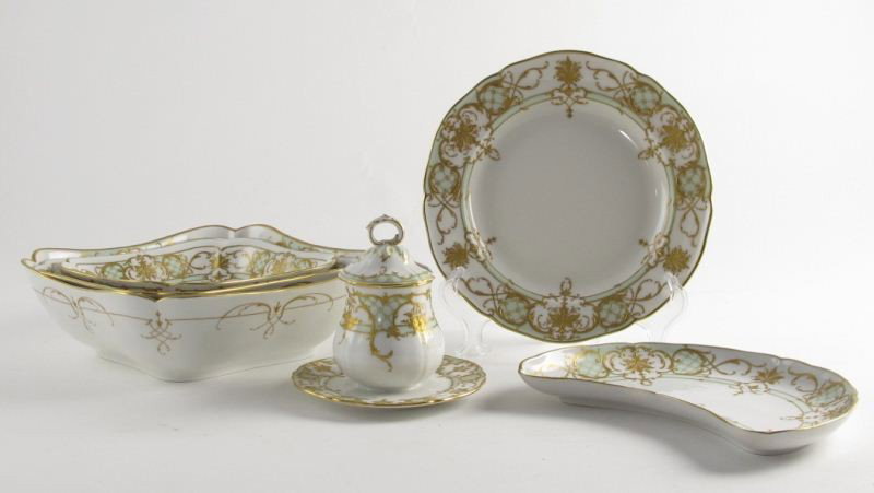 39pc KPM Porcelain Dinner Service: 39pc KPM Porcelain Dinner Service each piece with heavy Rococo style gilt ornamentation with pale green coloring, all with blue underglaze hallmark, some with red KPM over globe overglaze mark, includ