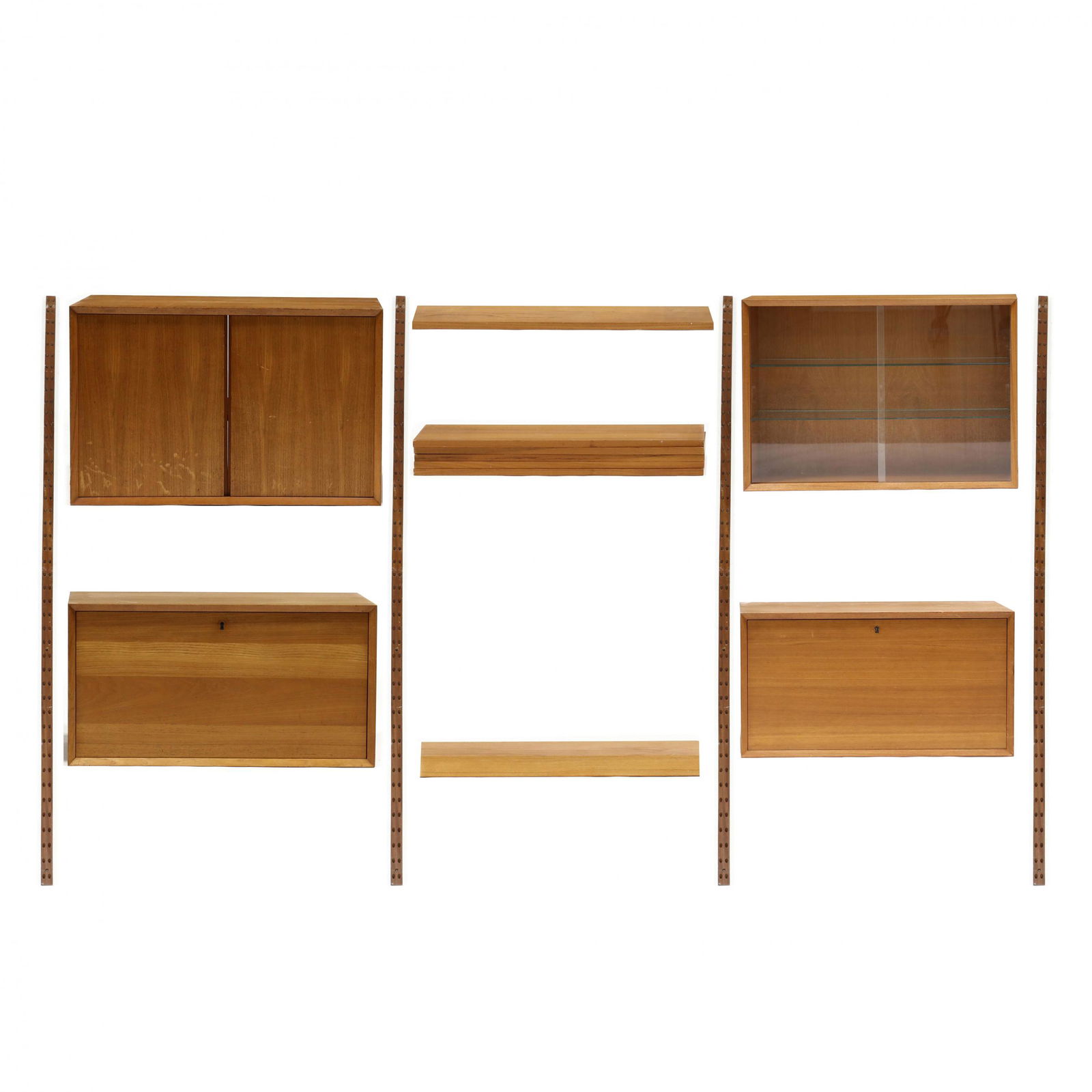Poul Cadovius (Denmark: Poul Cadovius (Denmark, 1911-2011), Teak Wall Unit1960s, for Cado, teak veneer, multi part form, including four wall mount brackets (79.75 in. long); (1) cabinet with two hinged doors (20.5 x 31.5 x 1