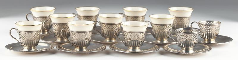 Set of (12) Tiffany & Co. Sterling Demitasse Cups: Set of (12) Tiffany & Co. Sterling Demitasse Cups including (12) sterling silver cups with (10) Lenox china inserts and (12) sterling silver saucers. Each with John C. Moore's Tiffany hallmark (circa 
