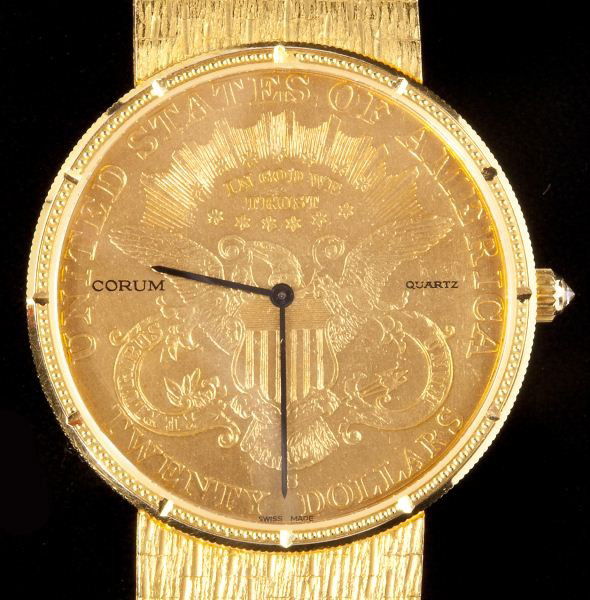 Gentleman's Gold Coin Wristwatch, Corum: Gentleman's Gold Coin Wristwatch, Corumwith the reverse of an 1889 $20 gold coin exposed for the face, having baton hands within gold bezel with cut marks indicating hour and brick pattern bracelet wi