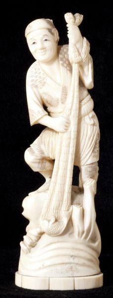 Japanese Ivory Okimono of a Fisherman: Japanese Ivory Okimono of a Fisherman Meiji Period, two-part form (figure and base), modeled as a man pulling his net from the sea, signed on the bottom. 7.5 in. Estate of the late Norman Caine, Ralei