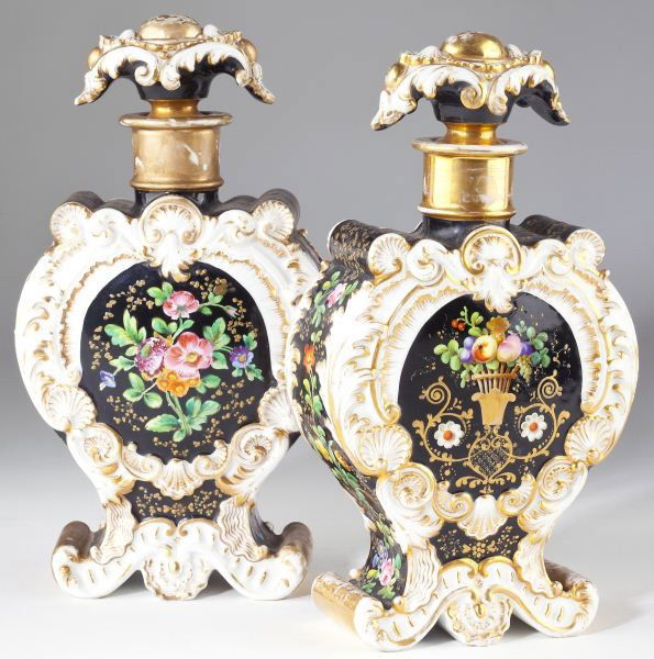 Pair of Jacob Petit Bottle Vases: Pair of Jacob Petit Bottle Vasesor scent bottles, with stoppers, mid-19th century, in the form of a pilgrim flask, cartouche shaped reserve with floral clusters hand-painted against a black field, she
