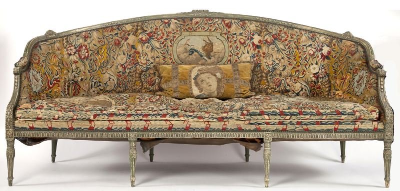 Adams Style Sofa: Adams Style Sofa late 19th century, carved and painted beechwood frame with leaf and floral pattern, the arched back with rounded corners, scrolled arms with upholstered rests, four fluted and tapered