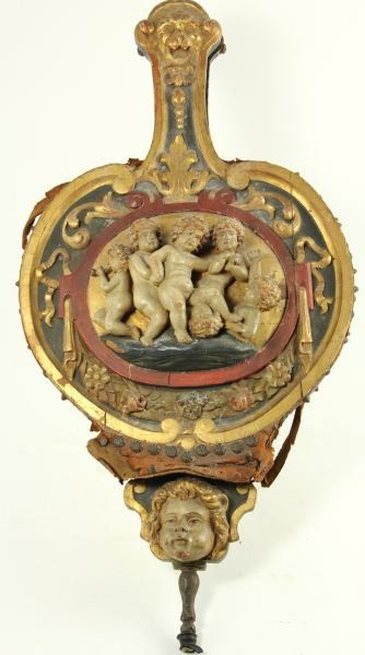 Antique Italian Carved and Gilt Bellows: Antique Italian Carved and Gilt Bellows18th century, C-form with central oval plaque featuring putti at play in high relief, surrounded by scrolls and floral swags, carved head of a cherub at base and