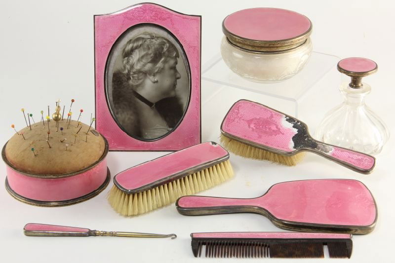 Eight Piece Sterling and Guilloche Vanity Set: Eight Piece Sterling and Guilloche Vanity Setby Gorham, each with pink enamel, the set includes an etched glass powder jar with cover and likely original puff, a comb, button hook, hand mirror, two br