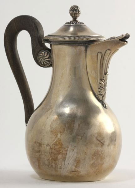 French Silver Hot Water Jug: French Silver Hot Water Jugearly 19th century, scrolling leaf pattern, reeded rim, ebony handle, with standard and guarantee hallmarks, likely 1st standard. ca. 1819-18389 in.18.2 troy oz