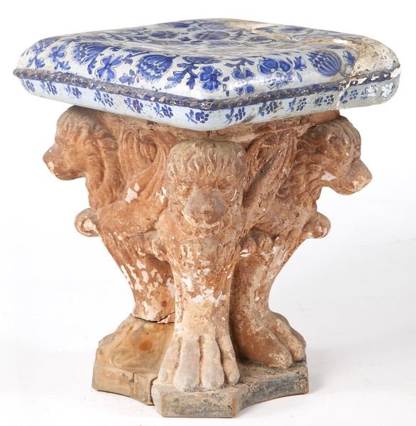 Spanish 16th Century Tabouret: Spanish 16th Century Tabouretterra cotta sculptured pedestal base in four lion motif, blue and white floral faience cushion form top.17.5 x 14 x 14 in.