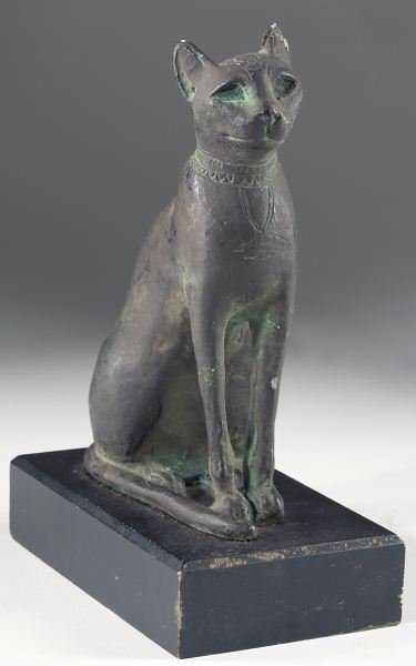 Metropolitan Museum of Art Cat Statuette: Metropolitan Museum of Art Cat Statuette after an Egyptian bronze original in the museum collection dating to the Ptolemaic Period, 3rd - 1st century, B.C., the reproduction raised on wooden base with