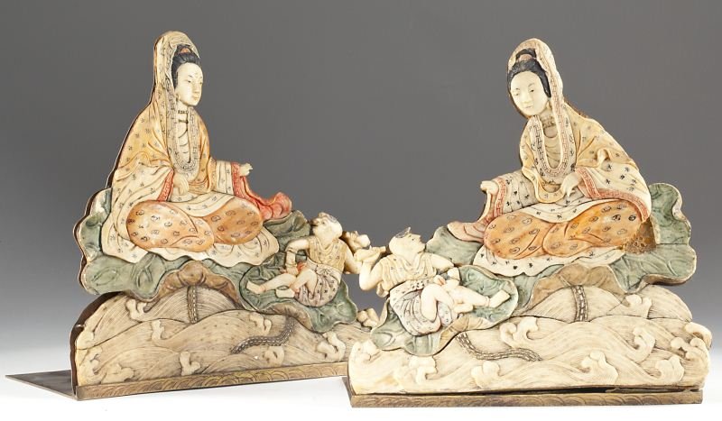 Pair of Antique Chinese Figural Bookends: Pair of Antique Chinese Figural Bookends circa 1890, each of carved and stained bone depicting a woman and her son on lotus leaves atop waves, with etched copper mount. 7.25 x 7.25 in.