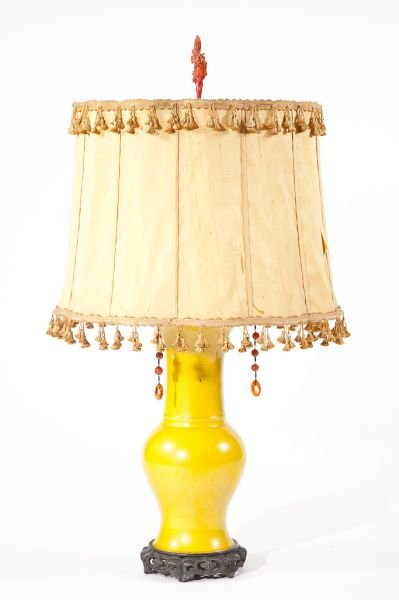 Chinese Porcelain Table Lamp: Chinese Porcelain Table Lamp possibly Kangxi period, baluster vase with flared rim, yellow glaze, with pierced iron base, red coral finial. HOA 38 in.; vase 16.5 in.
