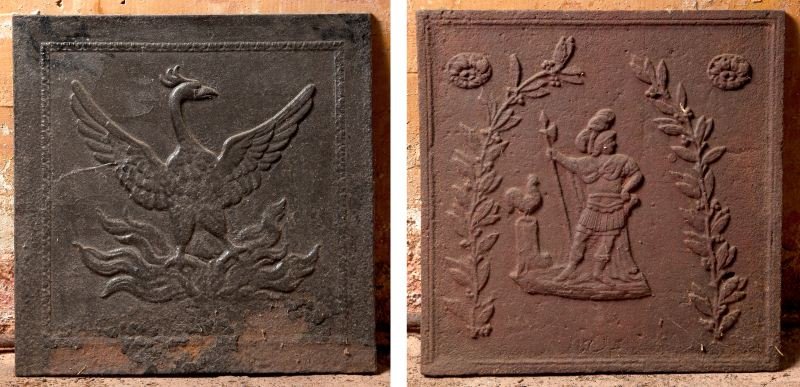 Two Cast Iron Firebacks: Two Cast Iron Firebacks 19th century, one depicts Mars standing before a rooster on a plinth (21 x 21 in.); the other is dominated by a phoenix with spread wings (19.5 x 19.5 in.).