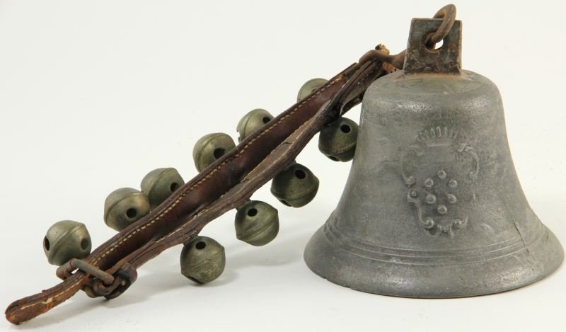 Antique Spanish Bronze Bells: Antique Spanish Bronze Bells including leather strap with eleven bells. 18 x 6 in.