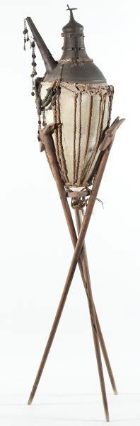 Persian Wine Jar with Teakwood Tripod Base: Persian Wine Jar with Teakwood Tripod Base18th century, terra cotta, dome top with bird finial, chain and coin decorations, antelope head finials on tripod base.DOA: 77 x 15 in. Jar: 36 in.