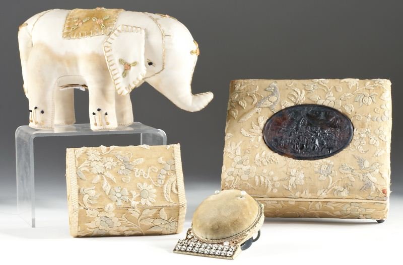 Vintage Silk Dresser Set: Vintage Silk Dresser Set (4) pieces: including silk satin elephant form pin cushion labeled "Eleanor Beard" (3.5 x 6.5 in.) with some staining; embroidered silk dresser box on four ball feet with carv